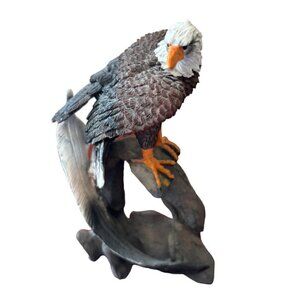 Eagle Statue Watching Resting on Branch with a Symbolic Feather